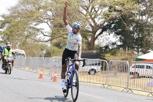 Cyclist Akimana Donatha from Rwanda celebrate’s winning women’s 60km race. 