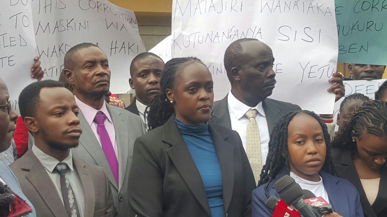 Lawyers Martina Swiga (centre) and Danstan Omari (to her left in white shirt) at the Milimani High Court over the Gatoto school case.