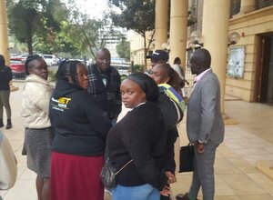 Relatives of the four abducted men at Mathare slums by allegedly by police two months ago consult at the Milimani High Court on August 17, 2027, after the mention of their case. 