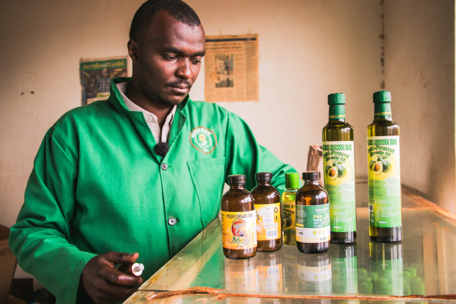 Patrick Mutahi, the founder and director of Mukurwe-ini Oil Enterprises Limited, showcase some of the products at the facility. 