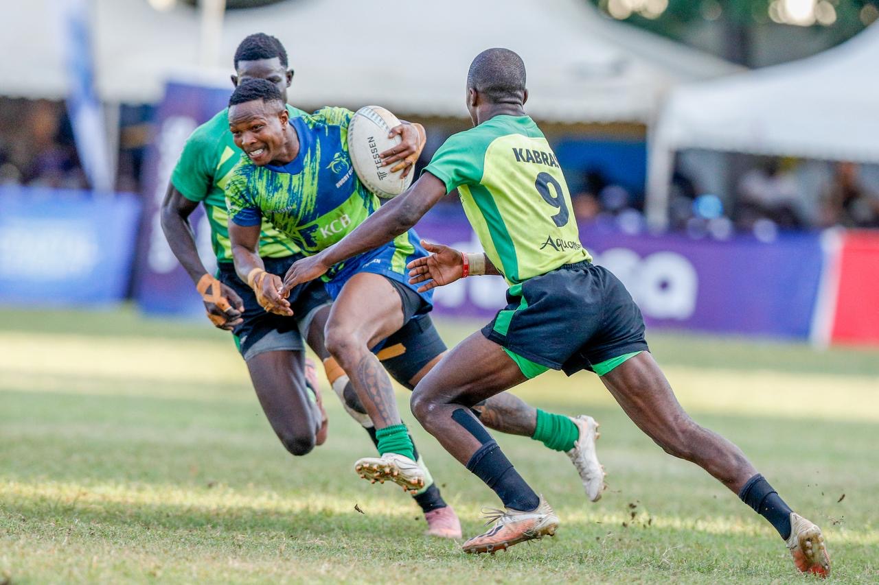 KCB Rugby player in action against a Kabras Sugar player.