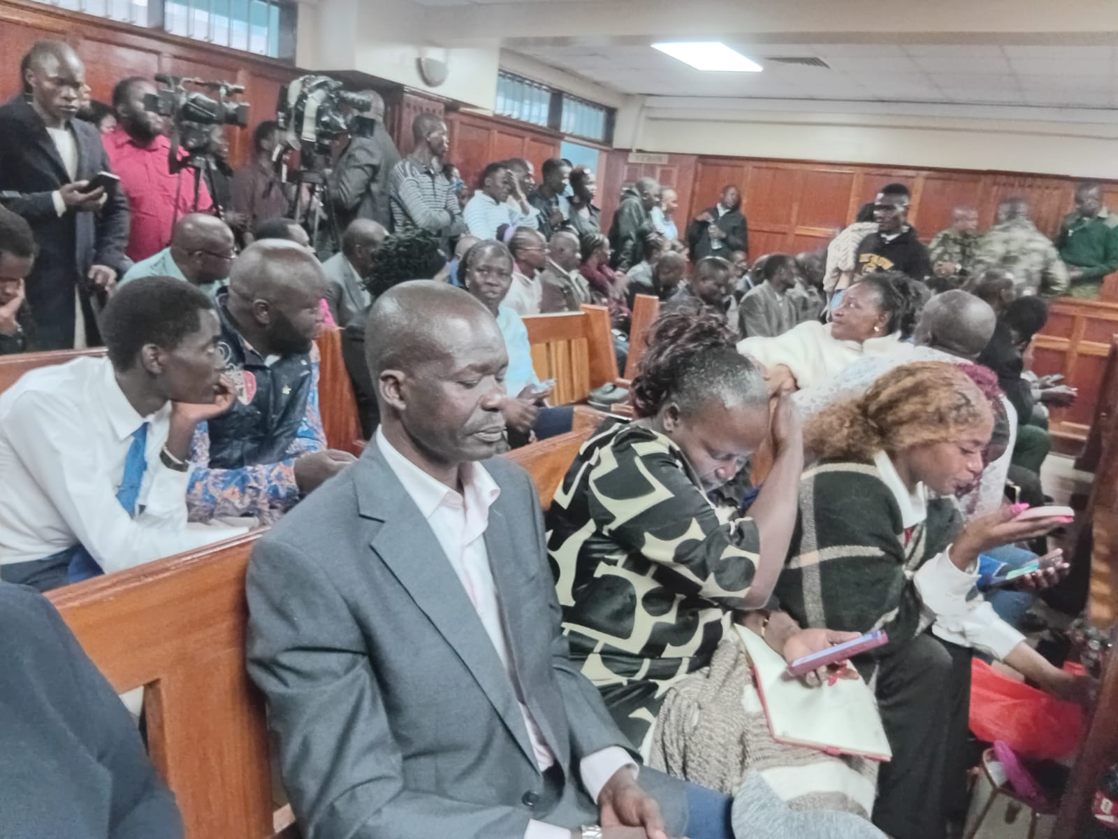 Parents of slain Rongo University student Sharon Otieno, Mzee Douglas Otieno and Melinda Auma and members of the public during mitigation hearing before sentencing of convicts Okoth Obado, his Personal Assistant Michael Juma Oyamo and Caspal Obiero